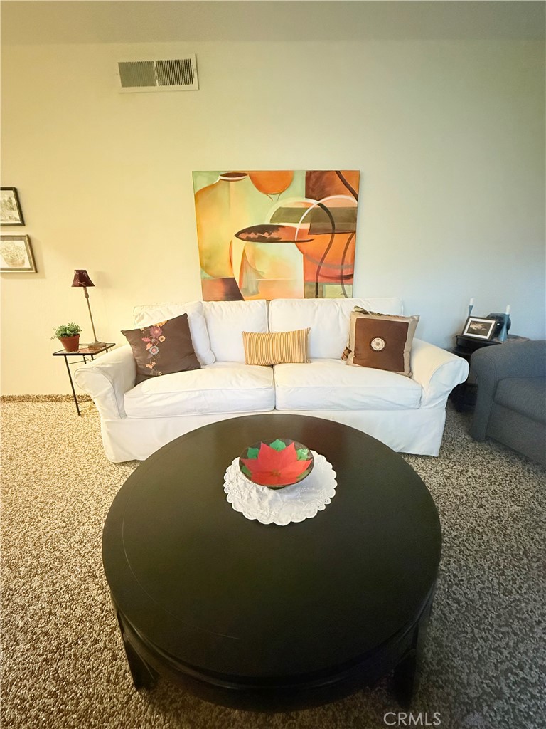 6380 North 5th Street Fresno, CA 93710 - Photo 5 of 31 a living room with furniture and a lamp