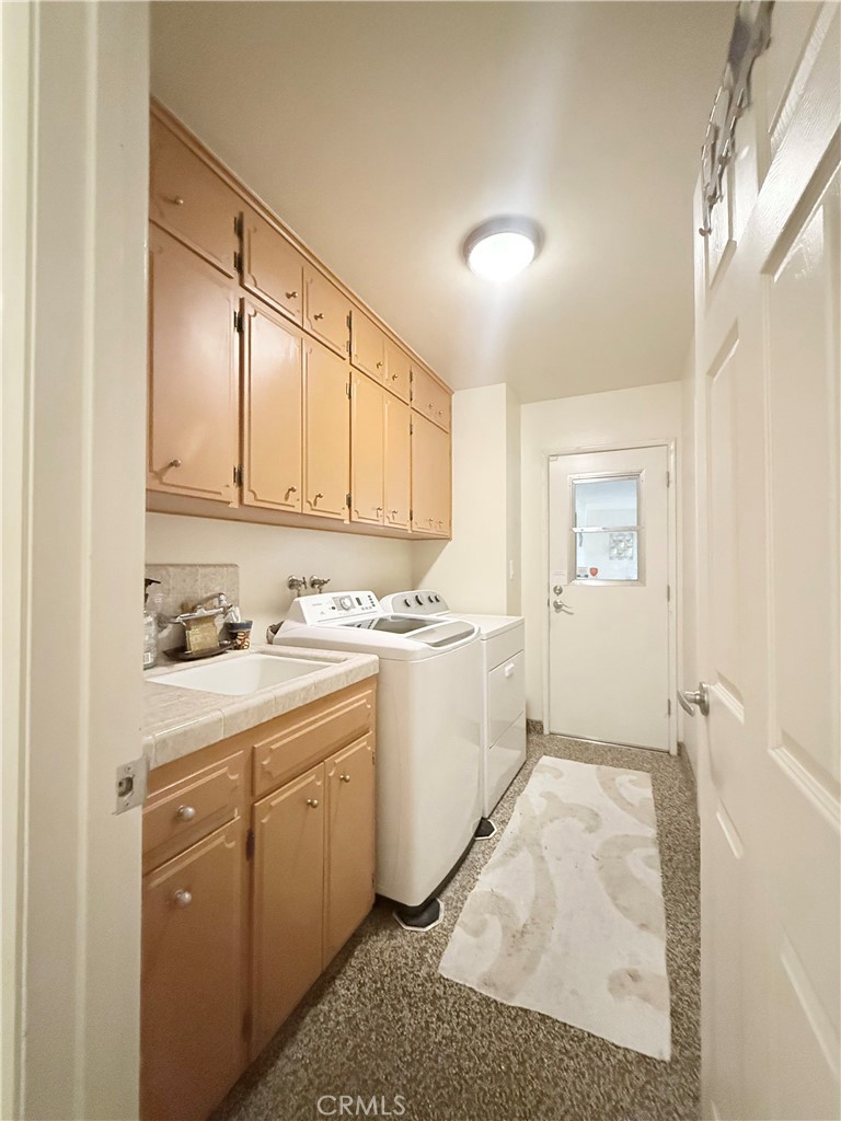 6380 North 5th Street Fresno, CA 93710 - Photo 9 of 31 a room with a sink cabinets and utility room