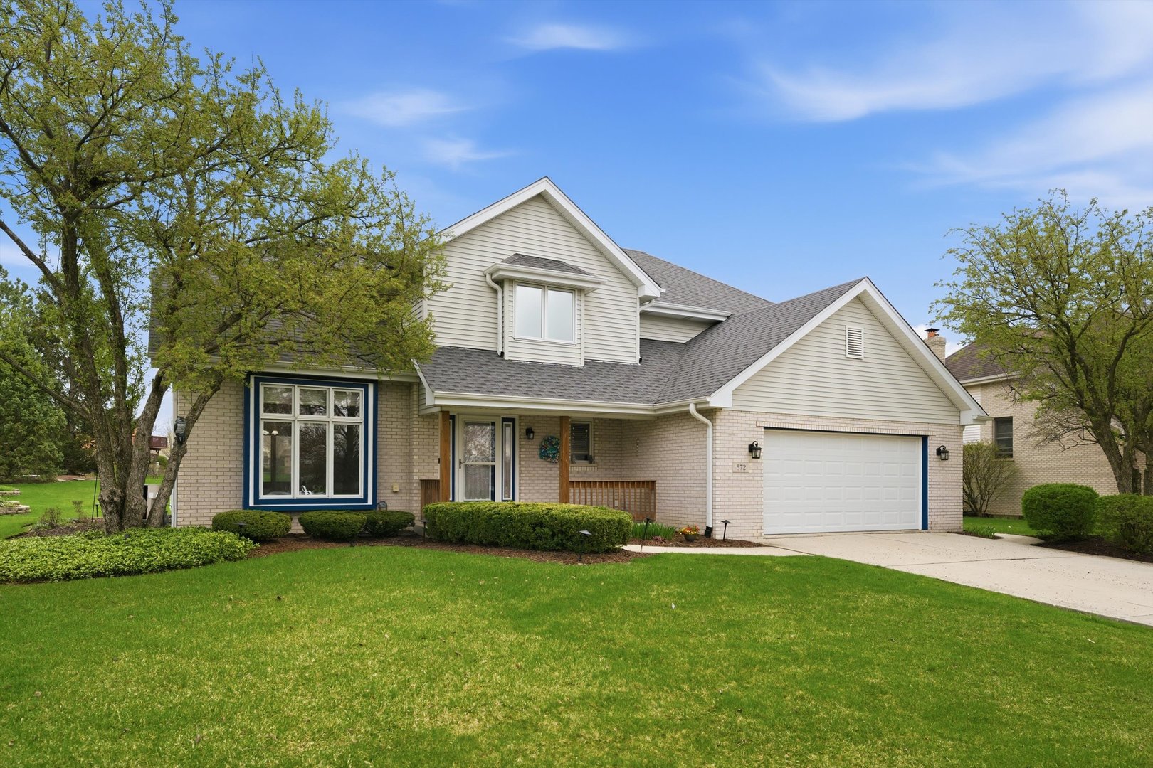572 Bishops Gate New Lenox, IL 60451 - Photo 1 of 37 a front view of a house with a yard and garage