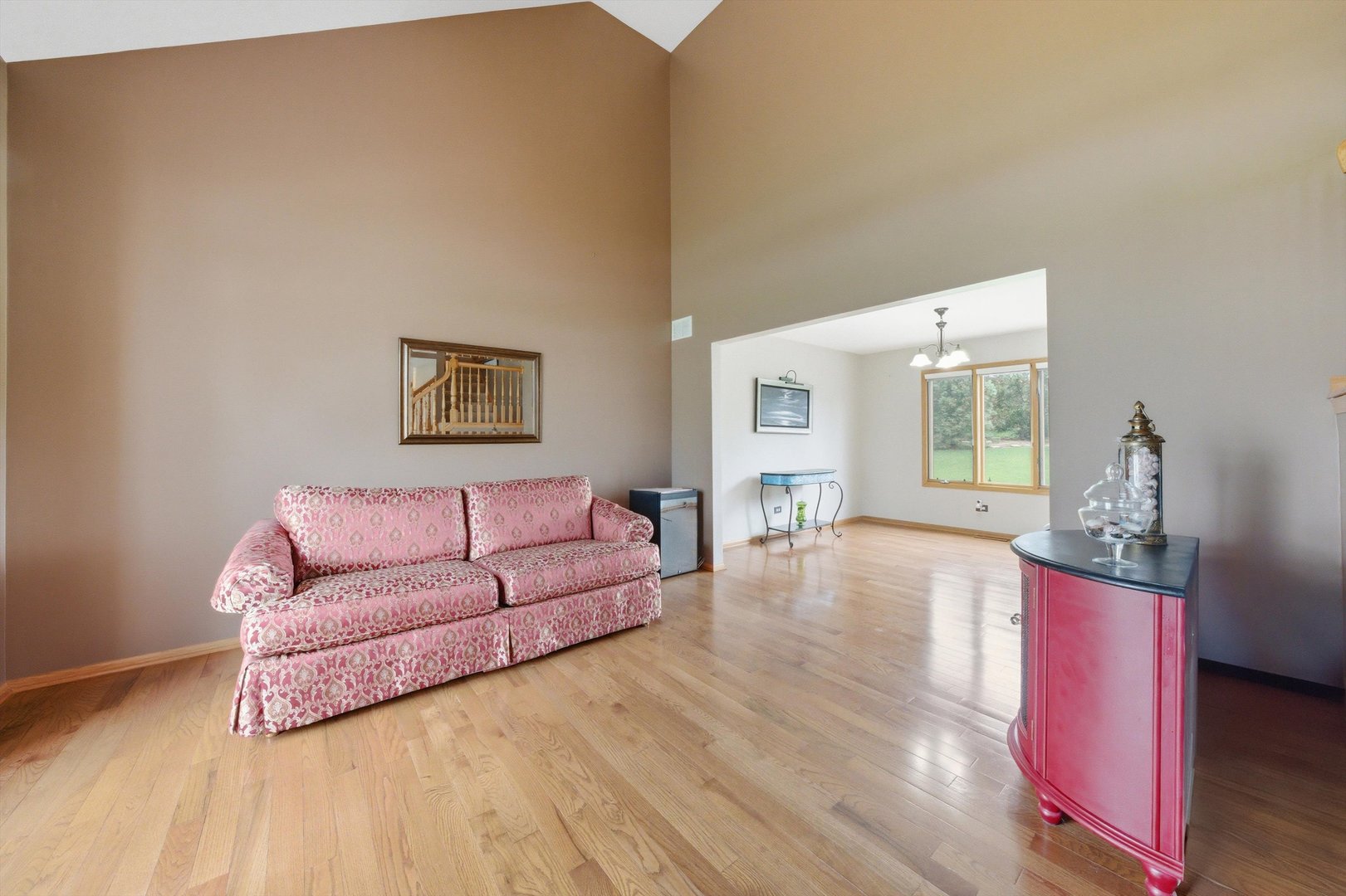 572 Bishops Gate New Lenox, IL 60451 - Photo 13 of 37 a living room with furniture and a wooden floor