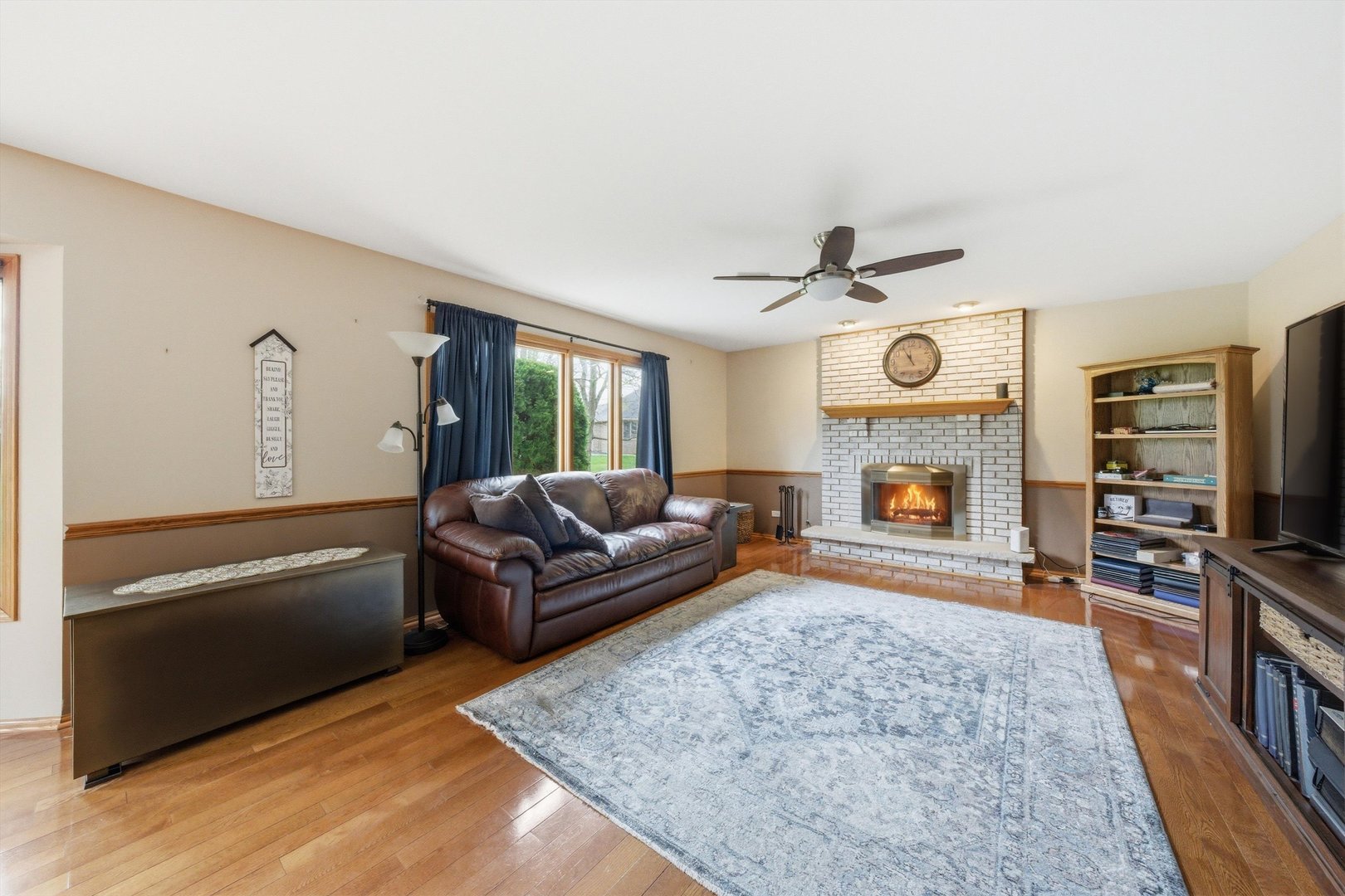 572 Bishops Gate New Lenox, IL 60451 - Photo 18 of 37 a living room with furniture and a fireplace