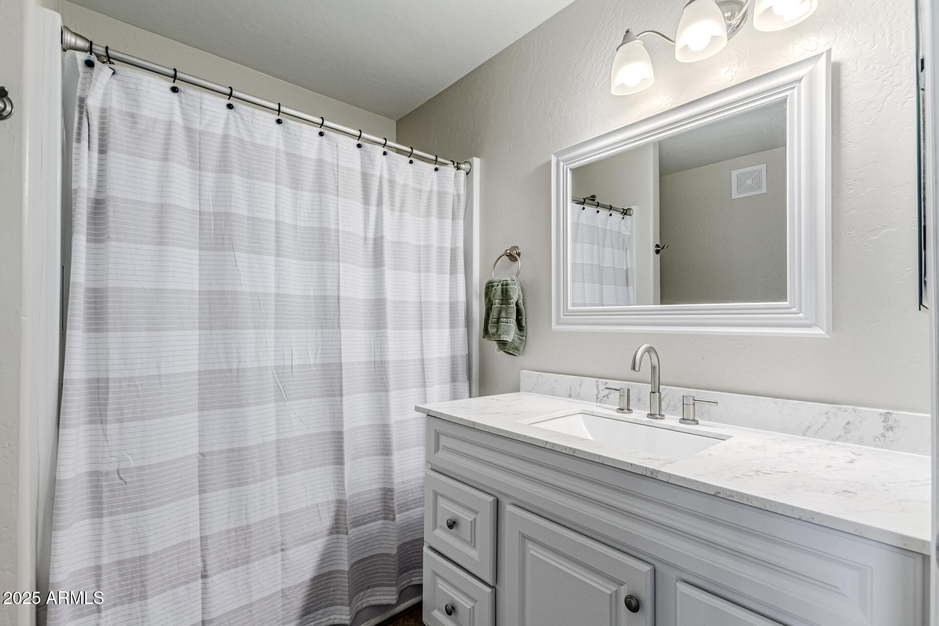 1287 North Alma School Road, Unit 156 Chandler, AZ 85224 - Photo 13 of 34 a bathroom with a sink and a mirror