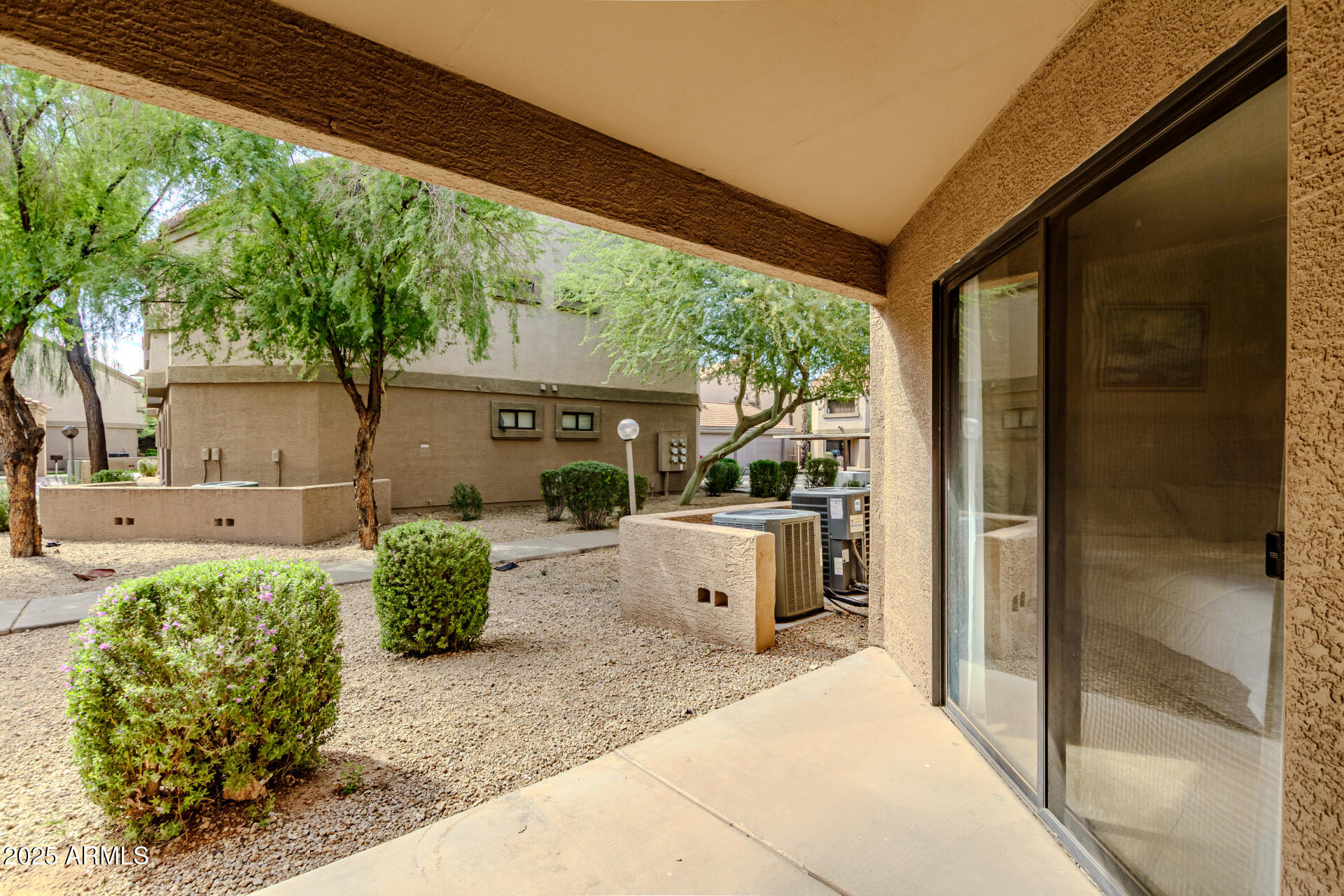 1287 North Alma School Road, Unit 156 Chandler, AZ 85224 - Photo 16 of 34 a front view of a house with garden