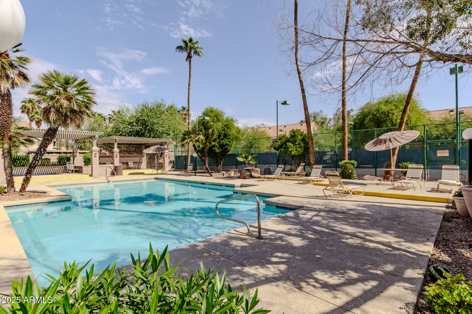 1287 North Alma School Road, Unit 156 Chandler, AZ 85224 - Photo 24 of 34 a view of a swimming pool with a patio