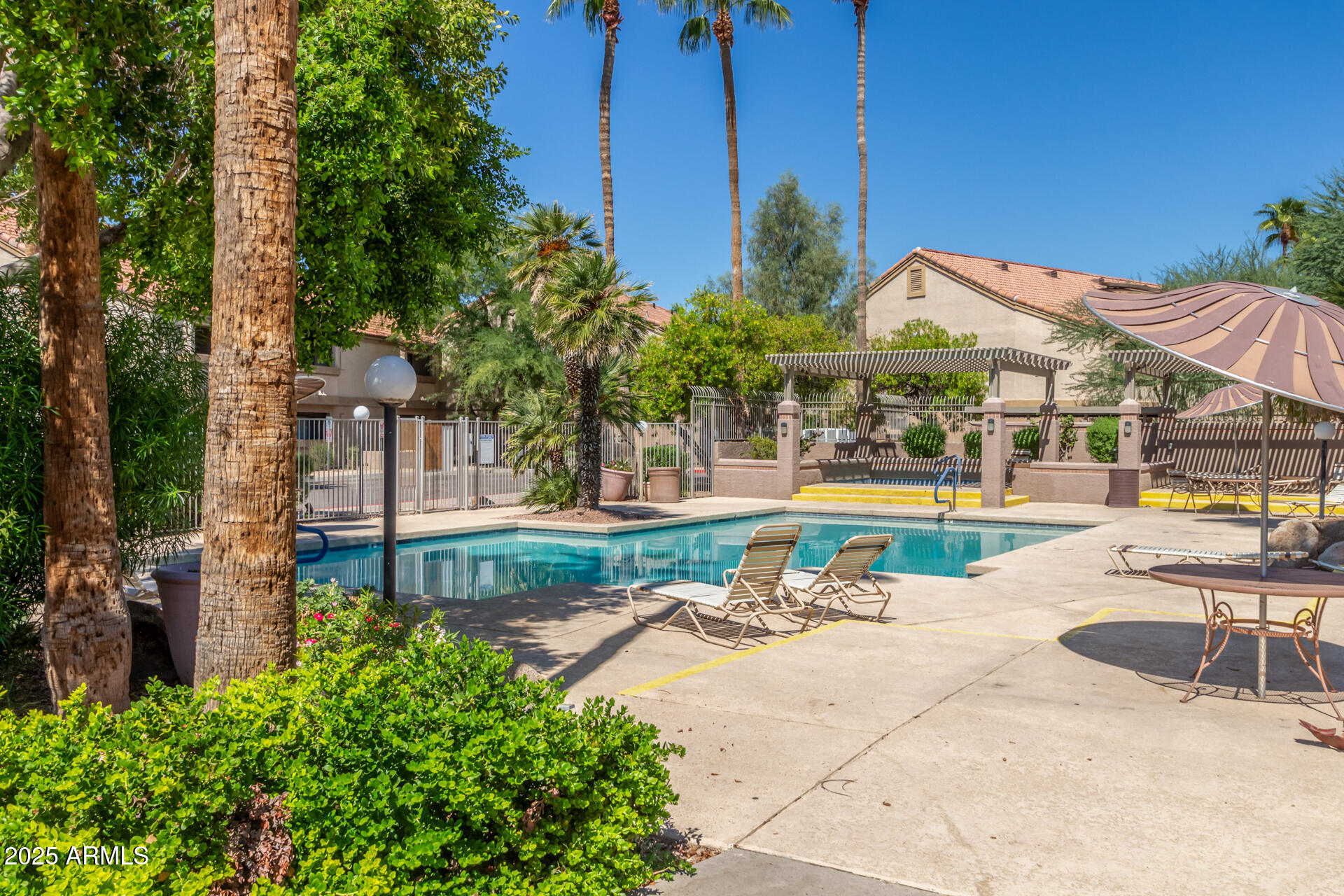 1287 North Alma School Road, Unit 156 Chandler, AZ 85224 - Photo 26 of 34 a view of a swimming pool with a patio