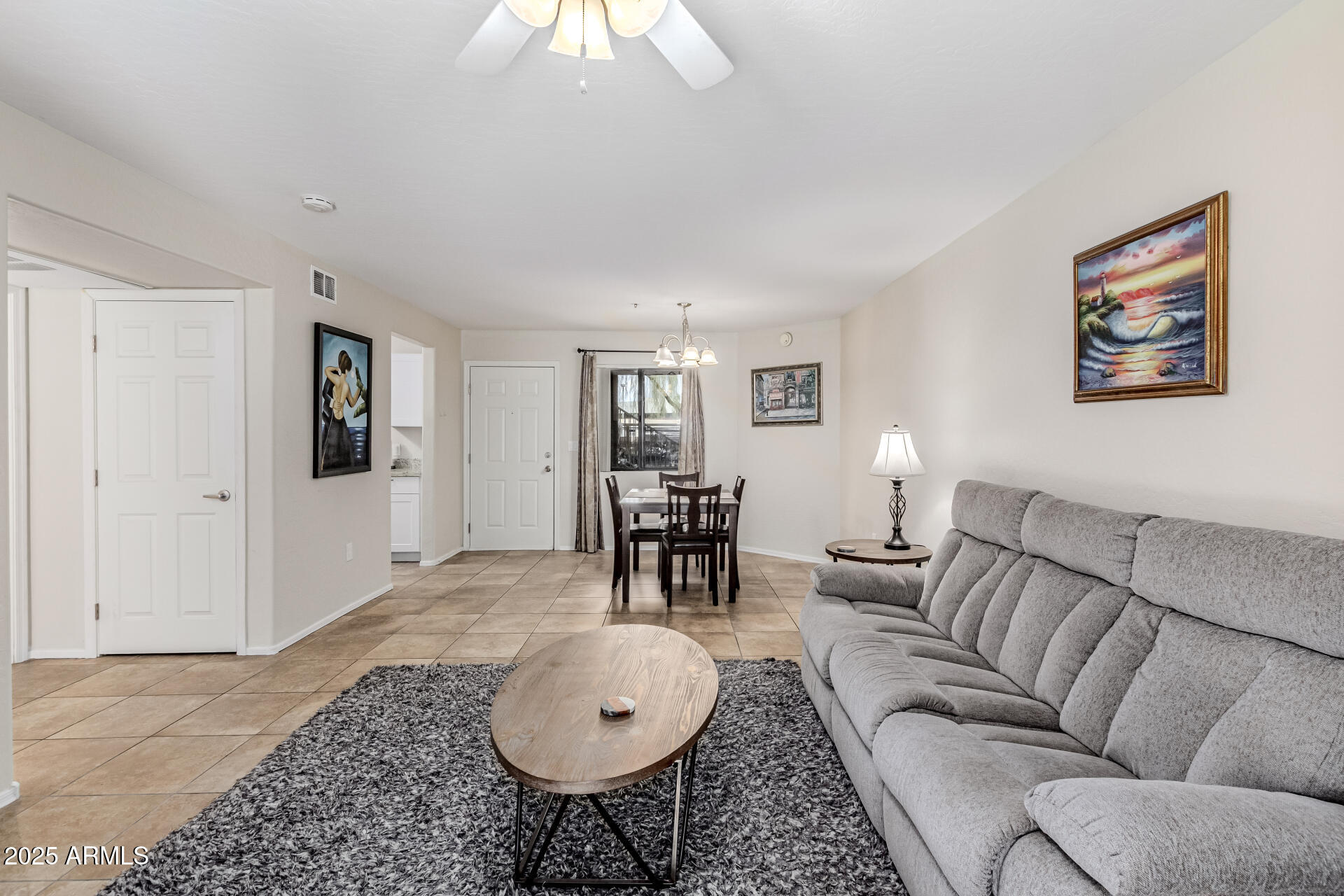1287 North Alma School Road, Unit 156 Chandler, AZ 85224 - Photo 4 of 34 a living room with furniture and wooden floor