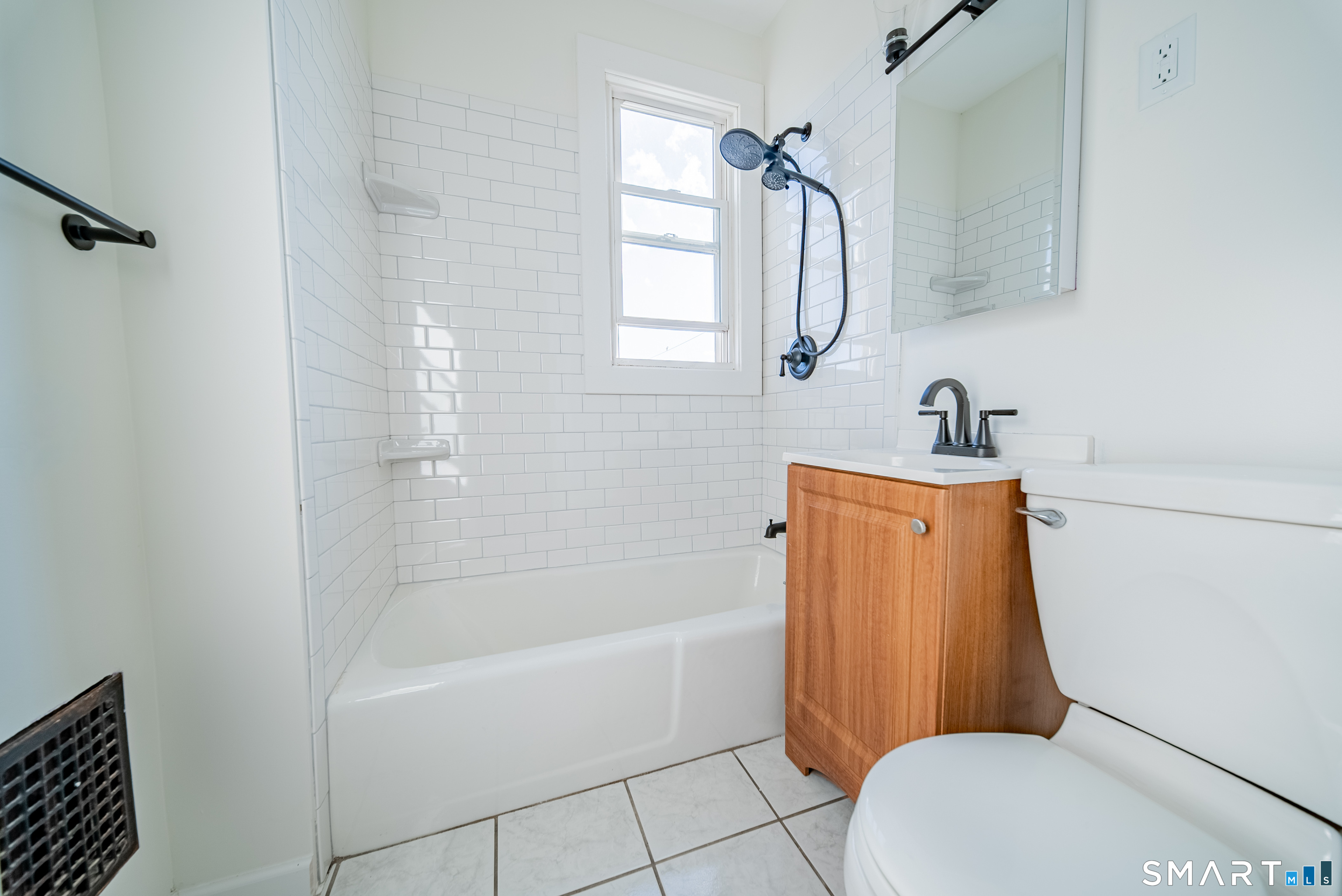 50 Jones Street West Haven, CT 06516 - Photo 11 of 21 a bathroom with a sink toilet and shower