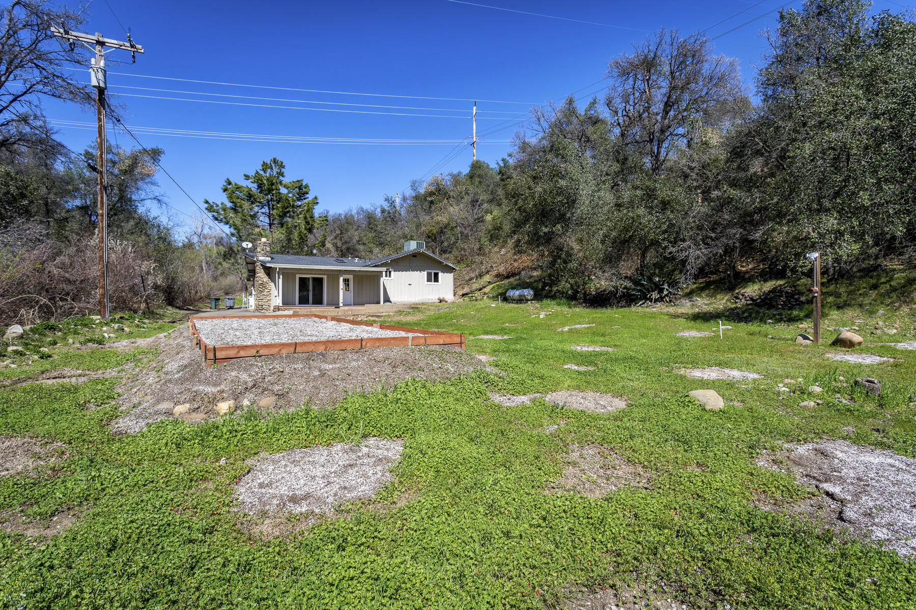 136 Quartz Hill Road Redding, CA 96003 - Photo 27 of 27 a house view with a garden space