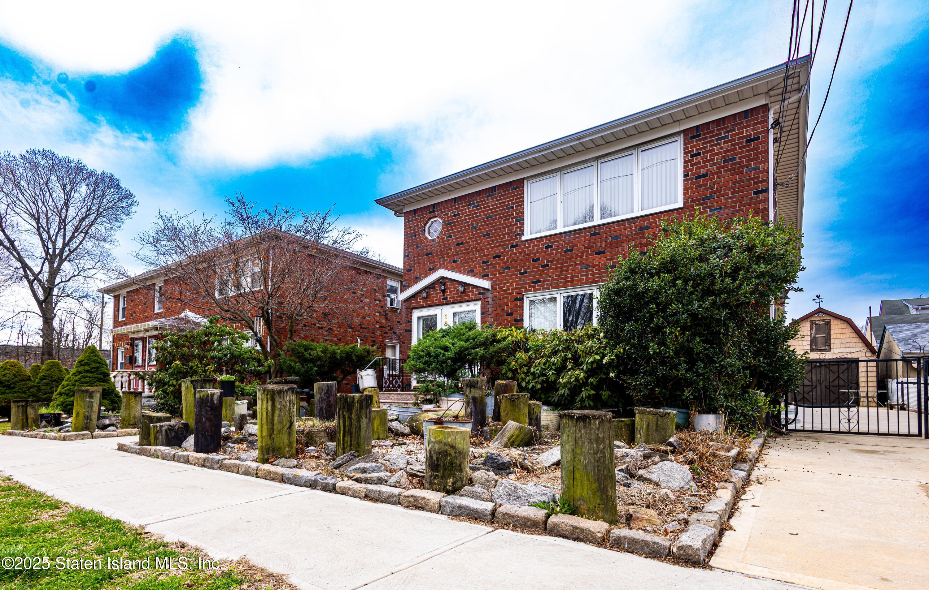 a view of house with outdoor space and swimming pool