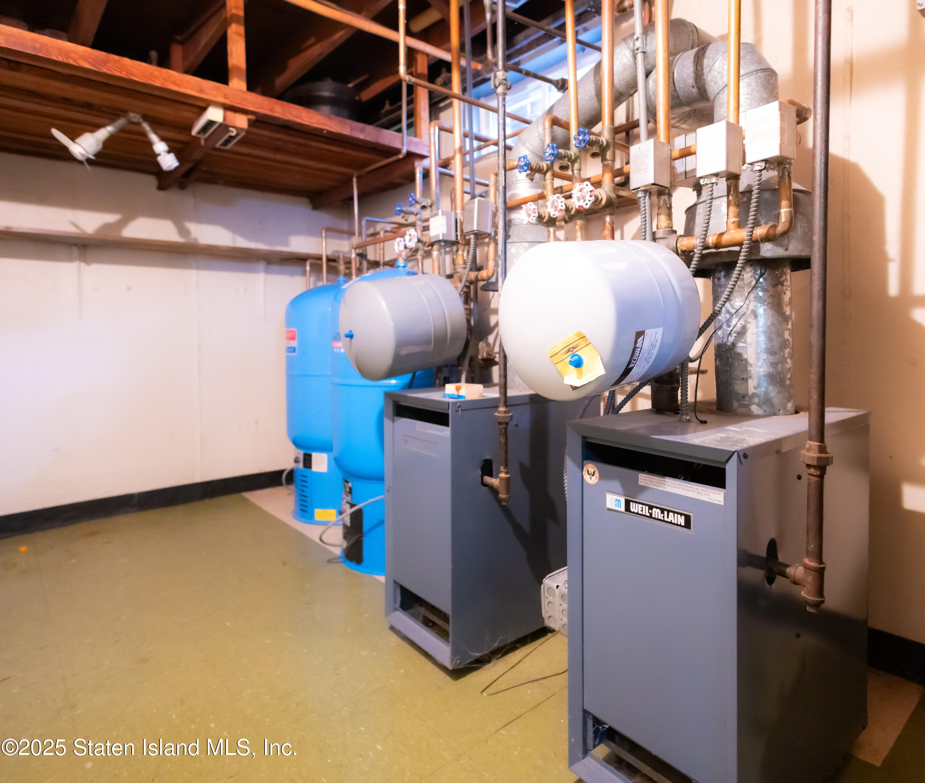 186 Raritan Avenue Staten Island, NY 10304 - Photo 34 of 51 a kitchen with a stove and a microwave