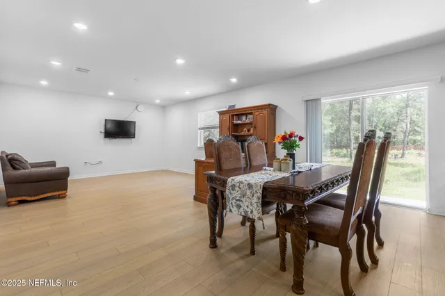 a bathroom with a granite countertop sink double and mirror
