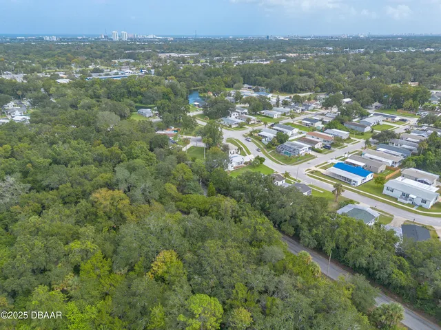 an aerial view of city and green space