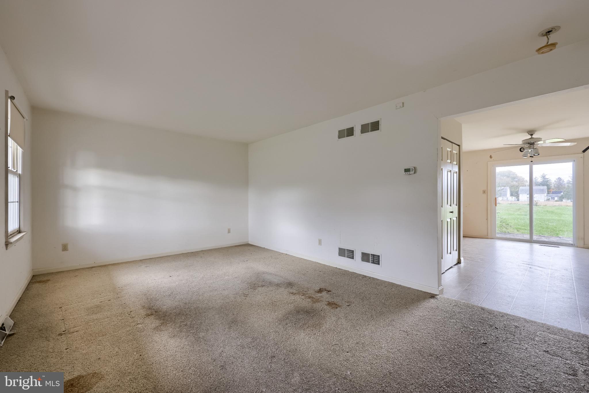 28 Brookview Drive Lititz, PA 17543 - Photo 14 of 31 an empty room with chandelier fan and windows