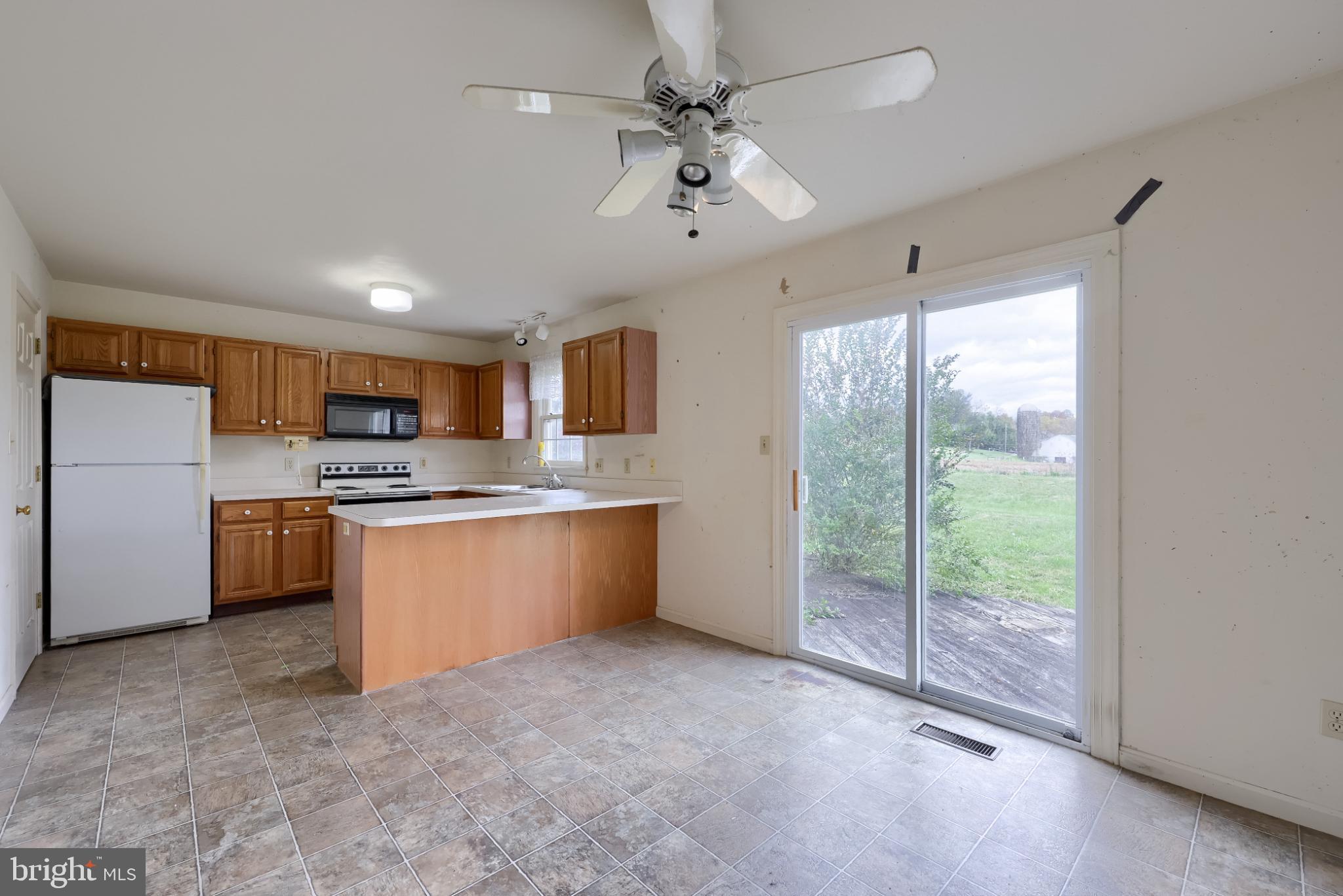 28 Brookview Drive Lititz, PA 17543 - Photo 22 of 31 a large kitchen with kitchen island a large counter top space a sink stainless steel appliances and cabinets