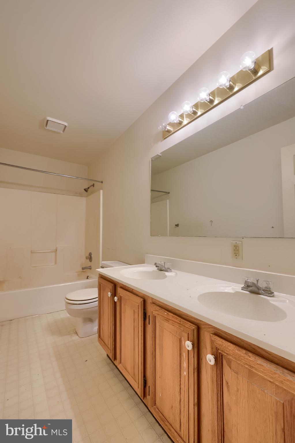 28 Brookview Drive Lititz, PA 17543 - Photo 28 of 31 a bathroom with a sink a toilet and a large mirror