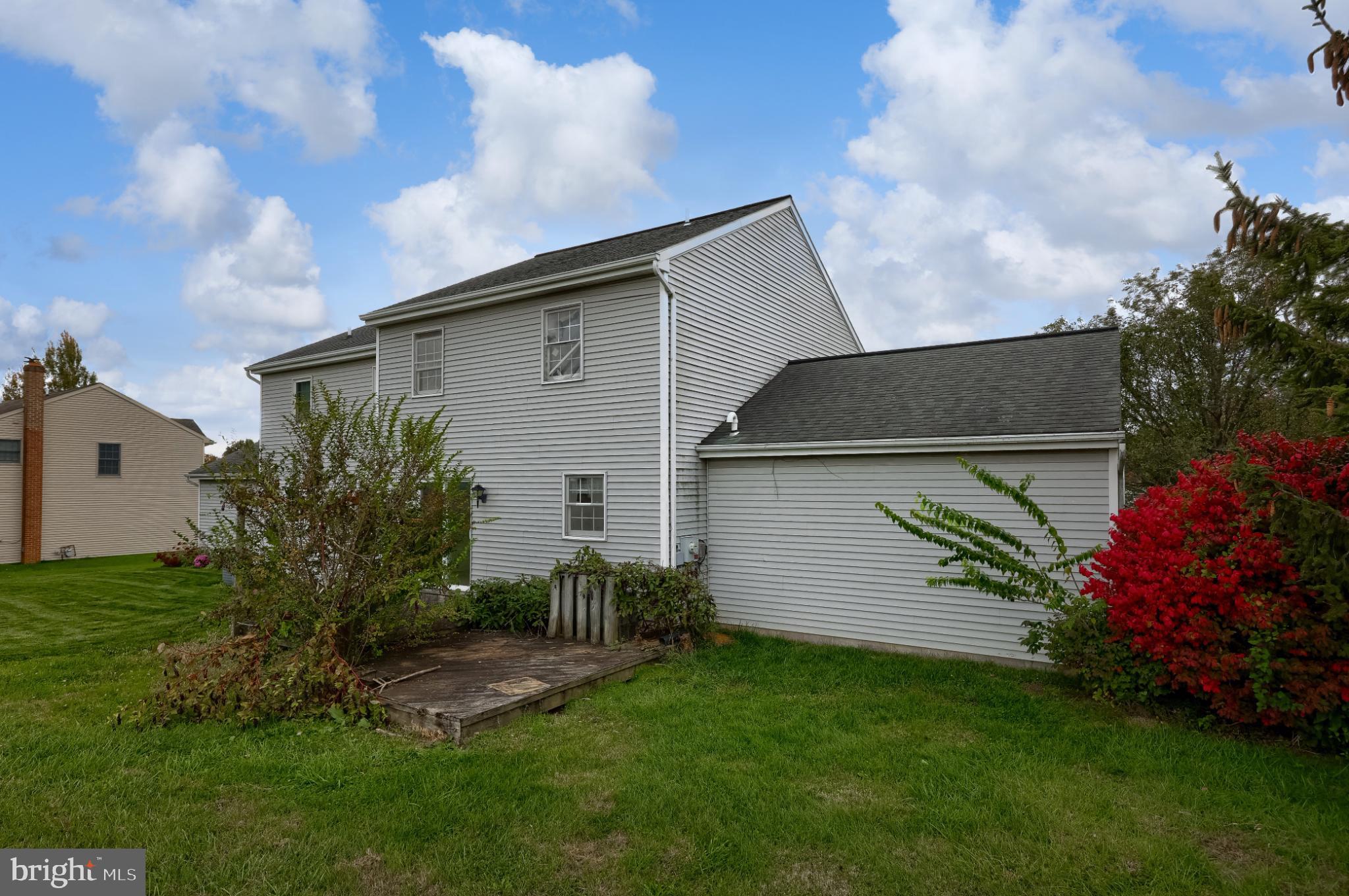 28 Brookview Drive Lititz, PA 17543 - Photo 8 of 31 a backyard of a house with plants and barbeque oven