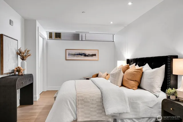 a bathroom with a sink a shower a mirror and a bathtub