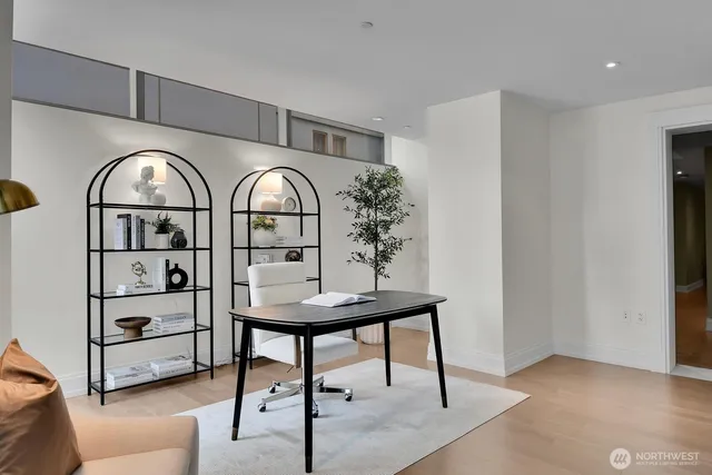 a living room with furniture a rug and a table