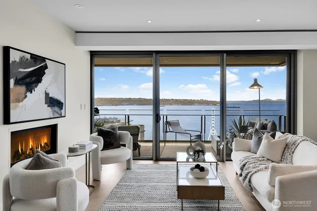 a living room with furniture tv and a large window