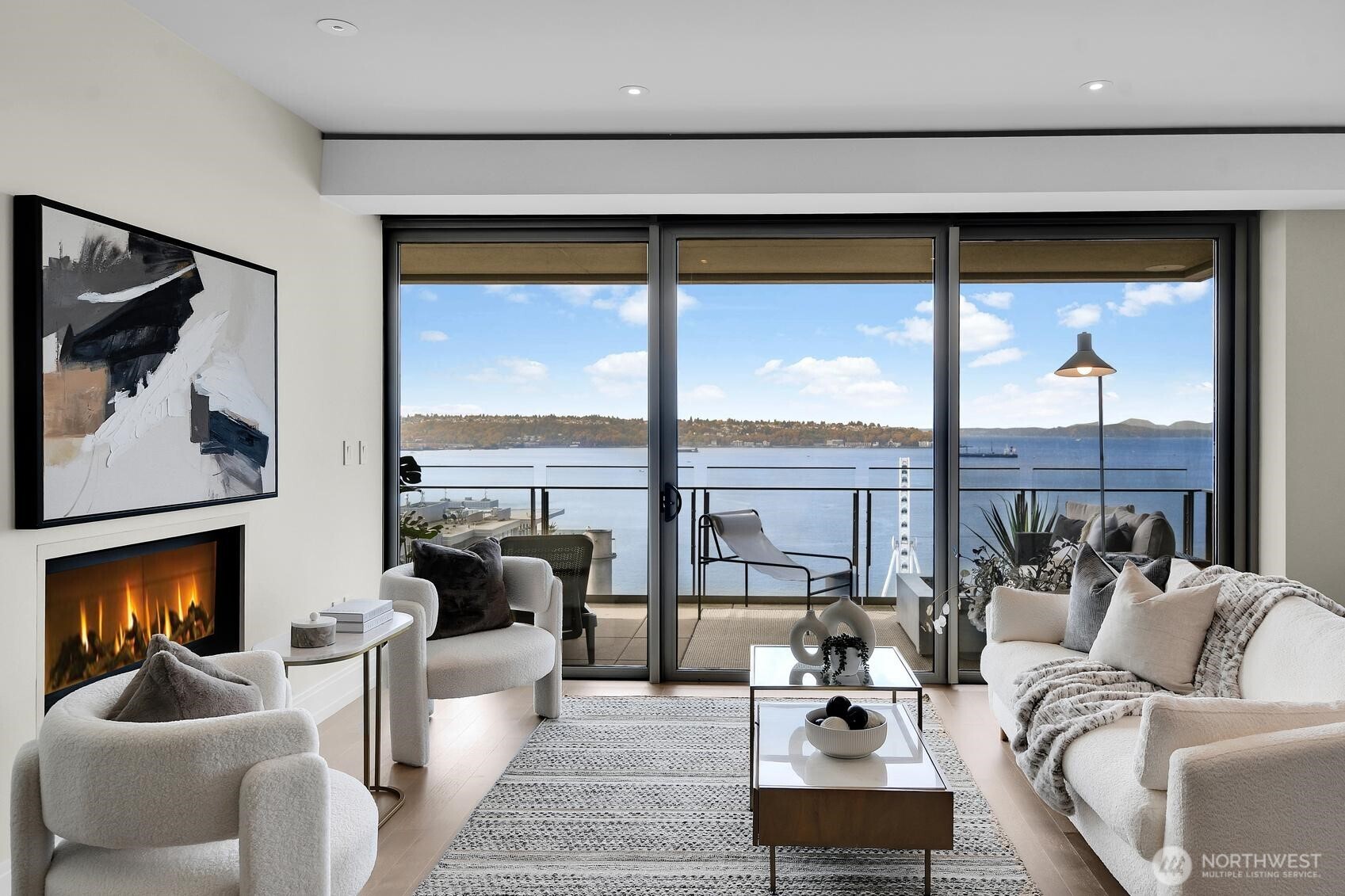 99 Union Street, Unit 1205 & 1206 Seattle, WA 98101 - Photo 2 of 40 a living room with furniture tv and a large window