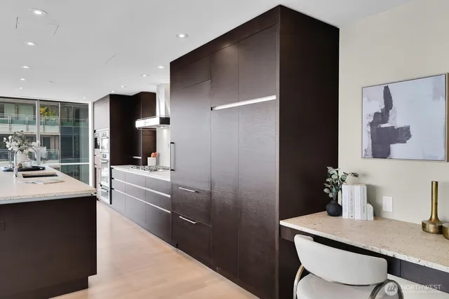 a kitchen with a table and chairs