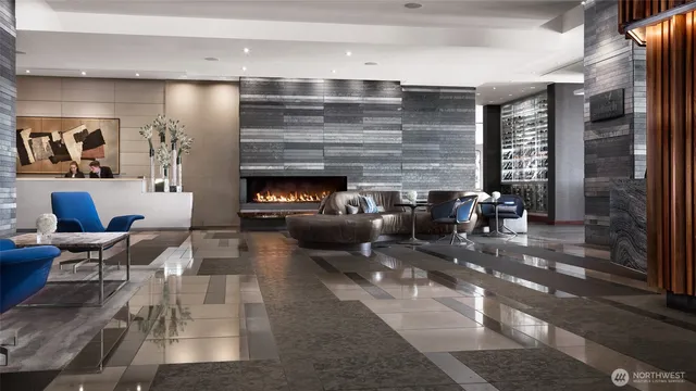 a view of dining room with wooden floor and windows