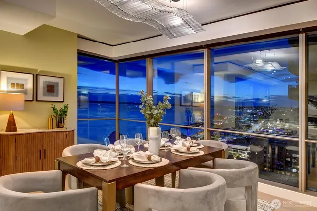 a view of a dining room with furniture and chandelier