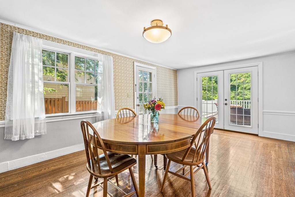 288 Mill Street Newton, MA 02460 - Photo 11 of 35 a view of a dining room with furniture and wooden floor