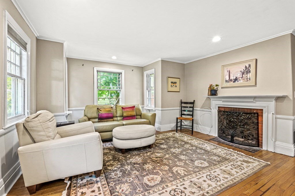 288 Mill Street Newton, MA 02460 - Photo 12 of 35 a living room with furniture a rug and a fireplace