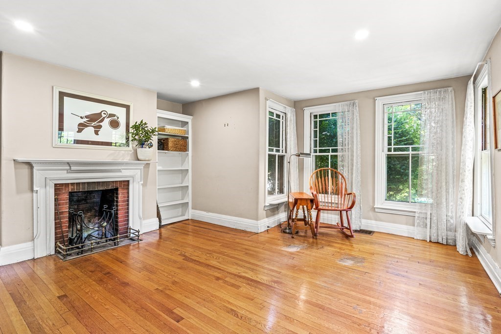 288 Mill Street Newton, MA 02460 - Photo 14 of 35 a living room with furniture and a fireplace