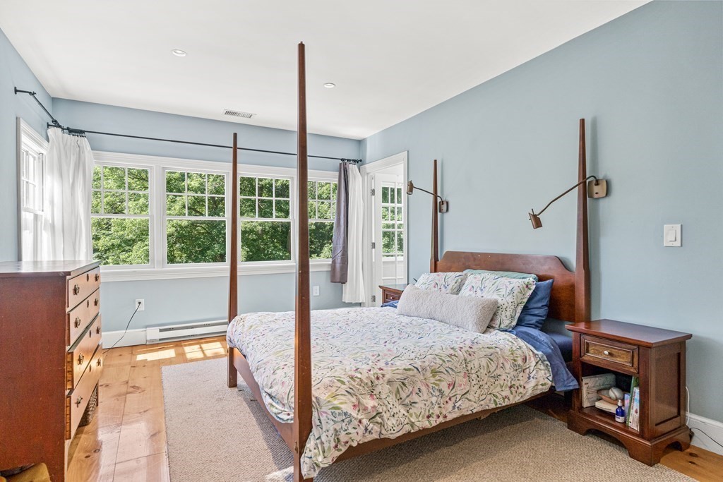 288 Mill Street Newton, MA 02460 - Photo 17 of 35 a bedroom with a bed and large window