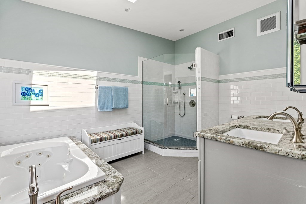 288 Mill Street Newton, MA 02460 - Photo 18 of 35 a spacious bathroom with a tub double sink and mirror