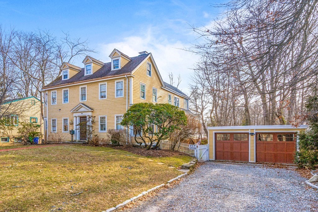 288 Mill Street Newton, MA 02460 - Photo 2 of 35 a view of a white house with a large tree next to a yard and a large tree
