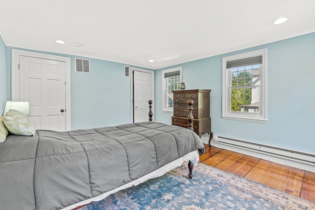 288 Mill Street Newton, MA 02460 - Photo 21 of 35 a bedroom with a bed and wooden floor