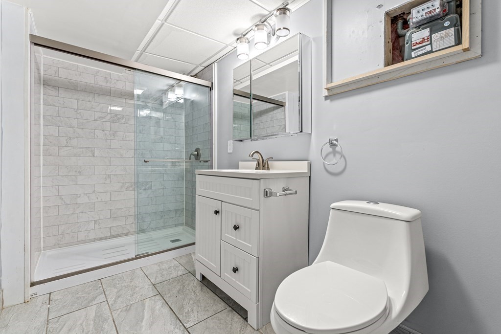 288 Mill Street Newton, MA 02460 - Photo 27 of 35 a white toilet sitting next to a bathroom sink
