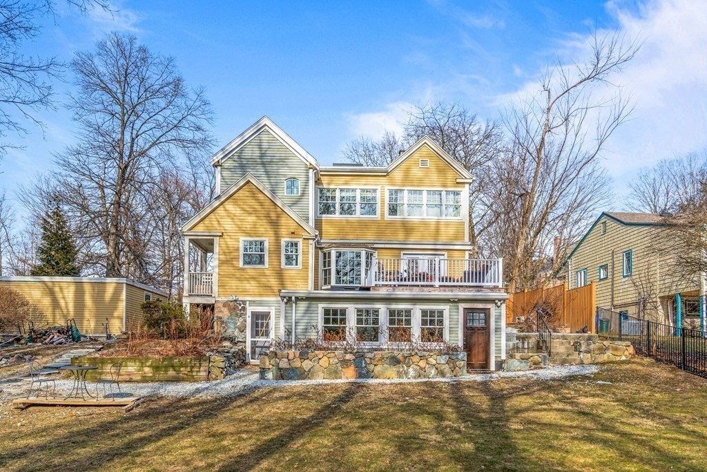 288 Mill Street Newton, MA 02460 - Photo 28 of 35 a view of a house with a fountain and snow