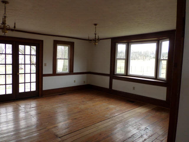 10982 Back Road Maurertown, VA 22644 - Photo 14 of 35 a view of an empty room with wooden floor and a window
