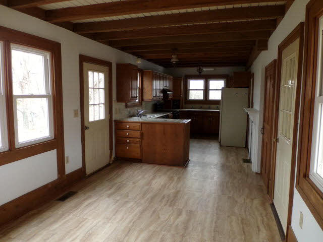 10982 Back Road Maurertown, VA 22644 - Photo 24 of 35 a kitchen with stainless steel appliances granite countertop a refrigerator a sink dishwasher a stove and white countertops with wooden floor