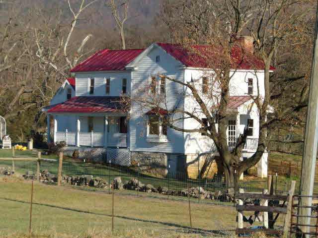 10982 Back Road Maurertown, VA 22644 - Photo 5 of 35 a front view of a house with a yard