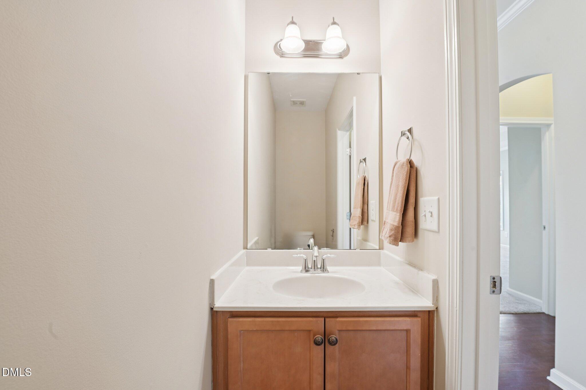 11 Hidden Ridge Court Durham, NC 27707 - Photo 12 of 30 a bathroom with a sink and a mirror