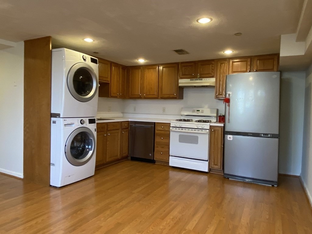 a view of a kitchen with washer and dryer