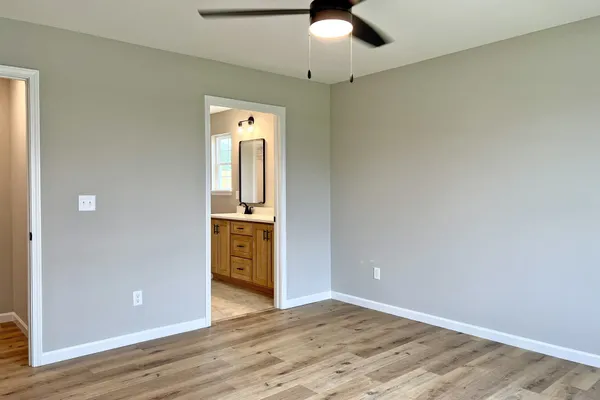 a view of a kitchen with a sink and a refrigerator