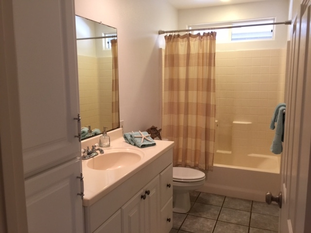 701 Kauhikoa Road Haiku, HI 96708 - Photo 17 of 27 a bathroom with a sink a toilet and shower