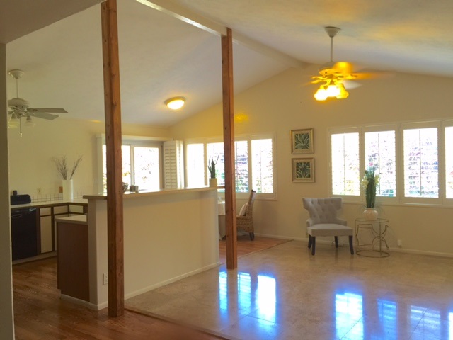 701 Kauhikoa Road Haiku, HI 96708 - Photo 4 of 27 a view of a livingroom with furniture wooden floor and windows