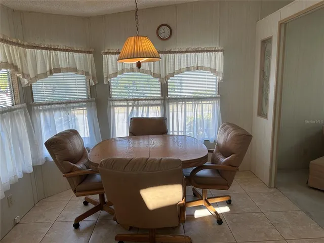 a view of a livingroom with furniture and a window