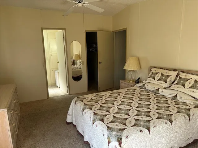 a bedroom with a bed and dresser