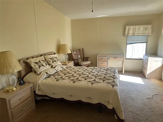 a bathroom with a granite countertop toilet and a shower