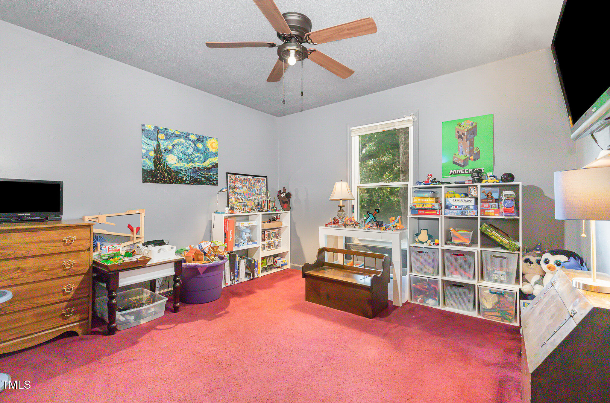 5840 Fayetteville Road Raleigh, NC 27603 - Photo 12 of 40 a view of a workspace with furniture and a flat screen tv