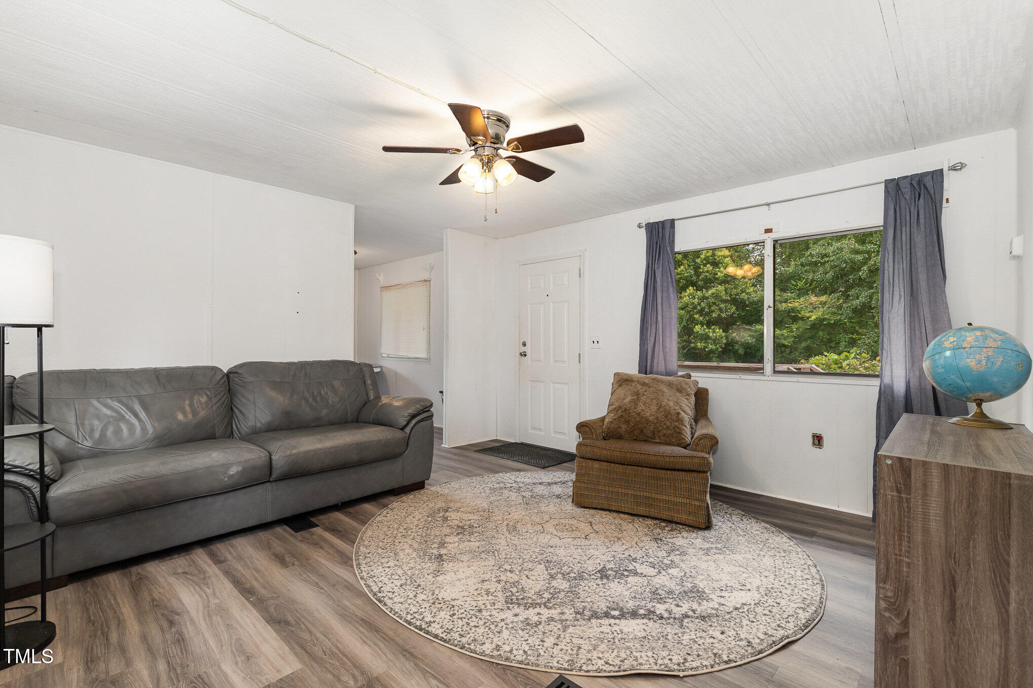 5840 Fayetteville Road Raleigh, NC 27603 - Photo 28 of 40 a living room with furniture and a window