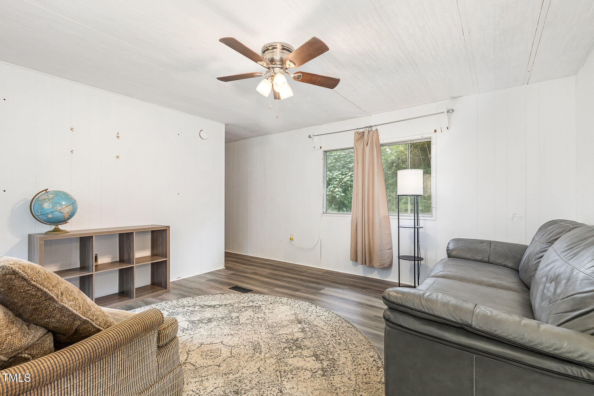 5840 Fayetteville Road Raleigh, NC 27603 - Photo 29 of 40 a living room with furniture and a large window